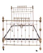 An Edwardian brass mounted metal bed, in