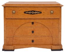 A maple chest of drawers in Biedermaier