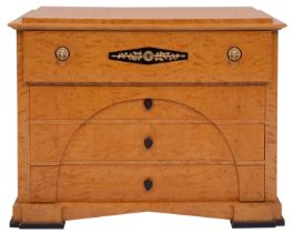 A maple chest of drawers in Biedermaier