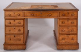 A Victorian oak pedestal desk, late 19th