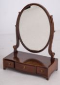 A mahogany dressing table mirror in Geor