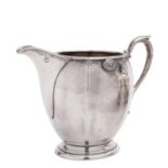 A George V silver milk jug by Edward Barnard & Sons Ltd, London 1933,