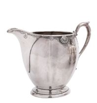A George V silver milk jug by Edward Barnard & Sons Ltd, London 1933,
