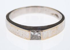 A contemporary white gold ring set with