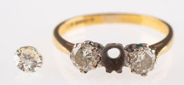 A 15ct gold three stone diamond ring, on