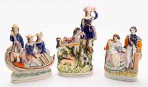 Three Staffordshire figure groups.