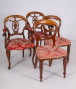 A pair of carved and stained hardwood an