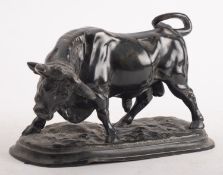 A patinated metal model of a bull, early