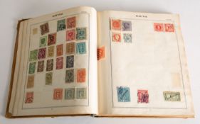 A collection of stamps in a Triumph albu