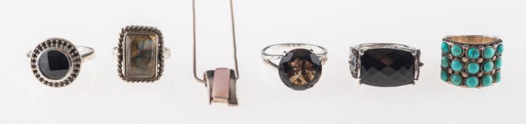 A group of five silver gem set rings, labradorite, turquoise,