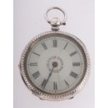 A silver pocket watch the dual with flor