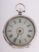 A silver pocket watch the dual with flor