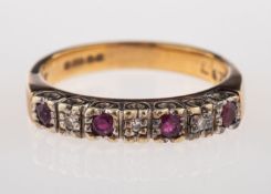A ruby and diamond ring, half set with c