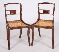 A pair of Regency mahogany, brass inlaid