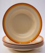 A set of six Clarice Cliff soup bowls, of plain form with orange painted borders.