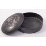 A bronze and silver inlaid oval box and