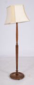 A stained hardwood standard lamp, 20th c