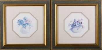 Two coloured prints of flowers in vases,