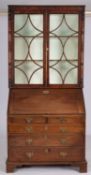 A mahogany bureau and associated bookcas