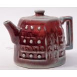 A Chinese copper red glazed teapot and c