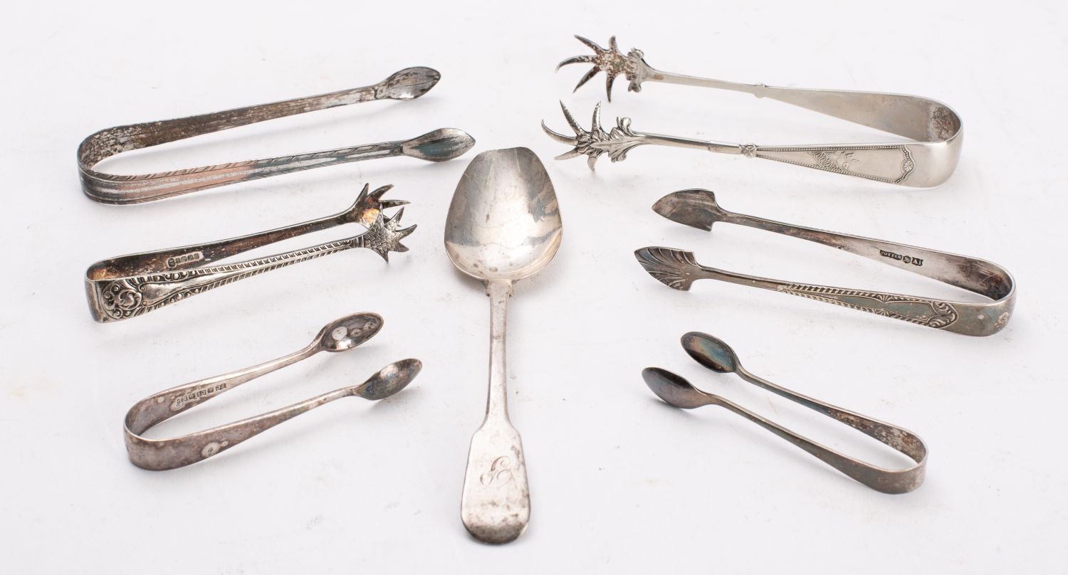 A silver dessert spoon and a pair of Old