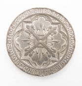 A pewter commemorative medallion depicting George and Dragon.