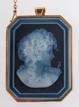 A 9ct yellow gold & blue agate cameo brooch, of a female bust with flower in hair, pendant fitting,