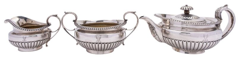 A George IV three piece silver tea service, maker's mark W.