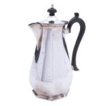 A George V silver hot water jug by Mappin and Webb, Sheffield 1919, of octagonal baluster form,