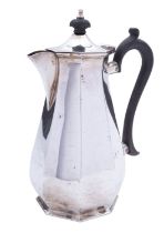 A George V silver hot water jug by Mappin and Webb, Sheffield 1919, of octagonal baluster form,