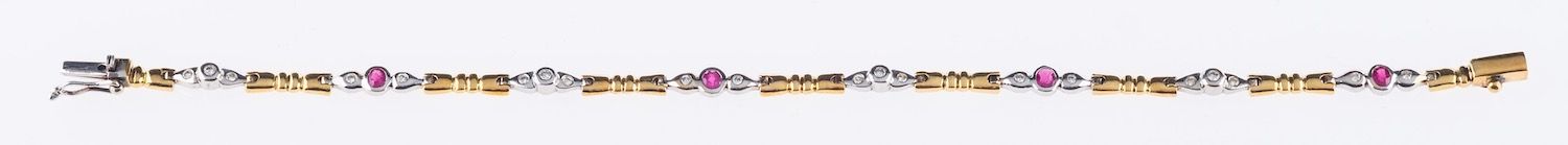 A bi-colour articulated line bracelet set with four oval-cut rubies interspaced by brilliant-cut - Image 2 of 2
