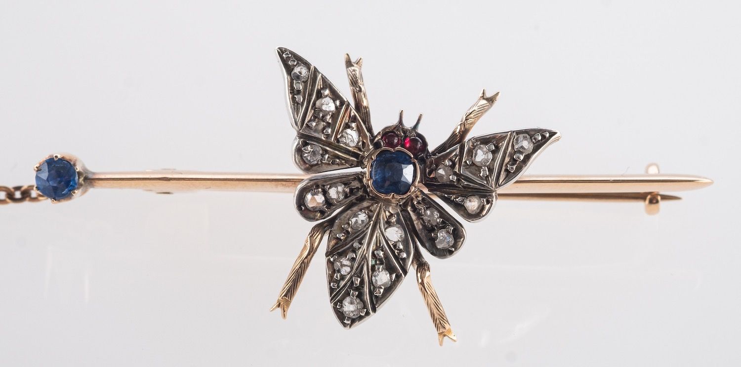 A Victorian insect brooch, depicting a butterfly set with rose-cut diamonds,