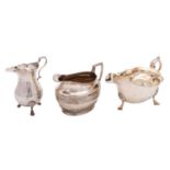 Two silver cream jugs and a sauce boat, the late Victorian oval jug by Henry Stratford,
