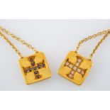A necklace with two diamond set Greek Cruciform motif pendants,