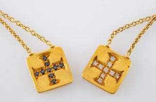 A necklace with two diamond set Greek Cruciform motif pendants,