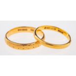 Two 22ct wedding bands, both D-shaped, UK hallmarked, sizes L 1/2 and K, total gross weight 4.