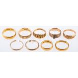 A group of various rings including three 22ct gold wedding bands, total gross weight 11.