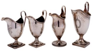 Four silver helmet shaped cream jugs, one with a threaded rim, maker's mark over-struck,