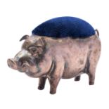 A silver novelty pig pin cushion by Henry Matthews, Birmingham 1911, with replacement blue velvet,