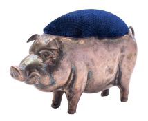 A silver novelty pig pin cushion by Henry Matthews, Birmingham 1911, with replacement blue velvet,
