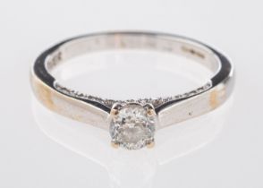 An 18ct white gold diamond solitaire ring, central brilliant-cut diamond 0.