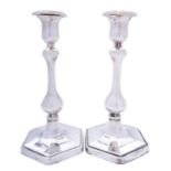 A pair of Edward VII silver candlesticks by Charles & George Asprey, London 1907, of hexagon form,