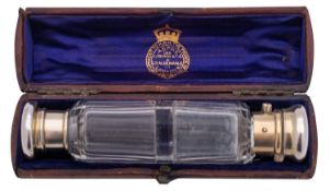 A Victorian silver gilt mounted faceted clear glass double ended scent bottle, maker's mark W.