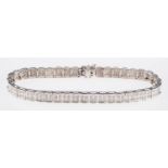 A double-row diamond bracelet of square articulated links,set with two rows of single-cut diamonds,