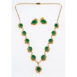 A necklace and earring set, a necklace of foliate and heart design set with eleven jade cabochons,