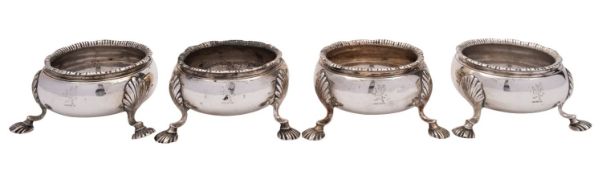 A set of four George III silver circular table salts possibly by Samuel Meriton I, London 1771,