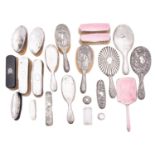 A group of silver backed hair brushes comprising: a pair of gentleman's hair brushes,