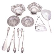 A group of silver items to include; a cased silver handled dressing table set,