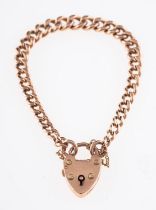 A heart padlock bracelet, with curb links and safety chain, (padlock clasp loose), marked 9ct,