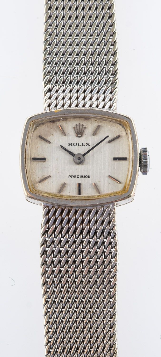 Rolex a lady's 9ct gold wristwatch the silvered cushion dial having raised baton numerals and baton